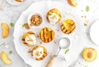 Honey-Grilled Peaches with Warm Spiced Crumble and Honey Glaze