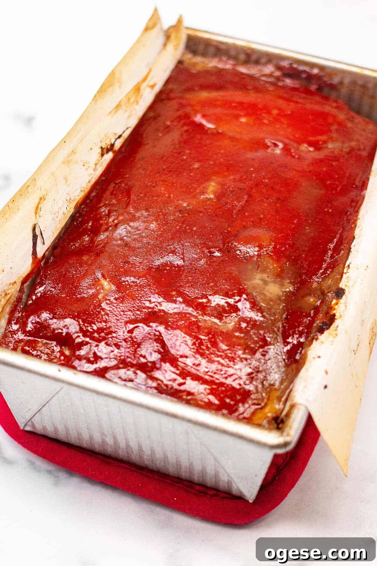 Classic Ritz-Crusted Meatloaf Recipe for Tender, Savory Results 8 Baked meatloaf covered in ketchup glaze