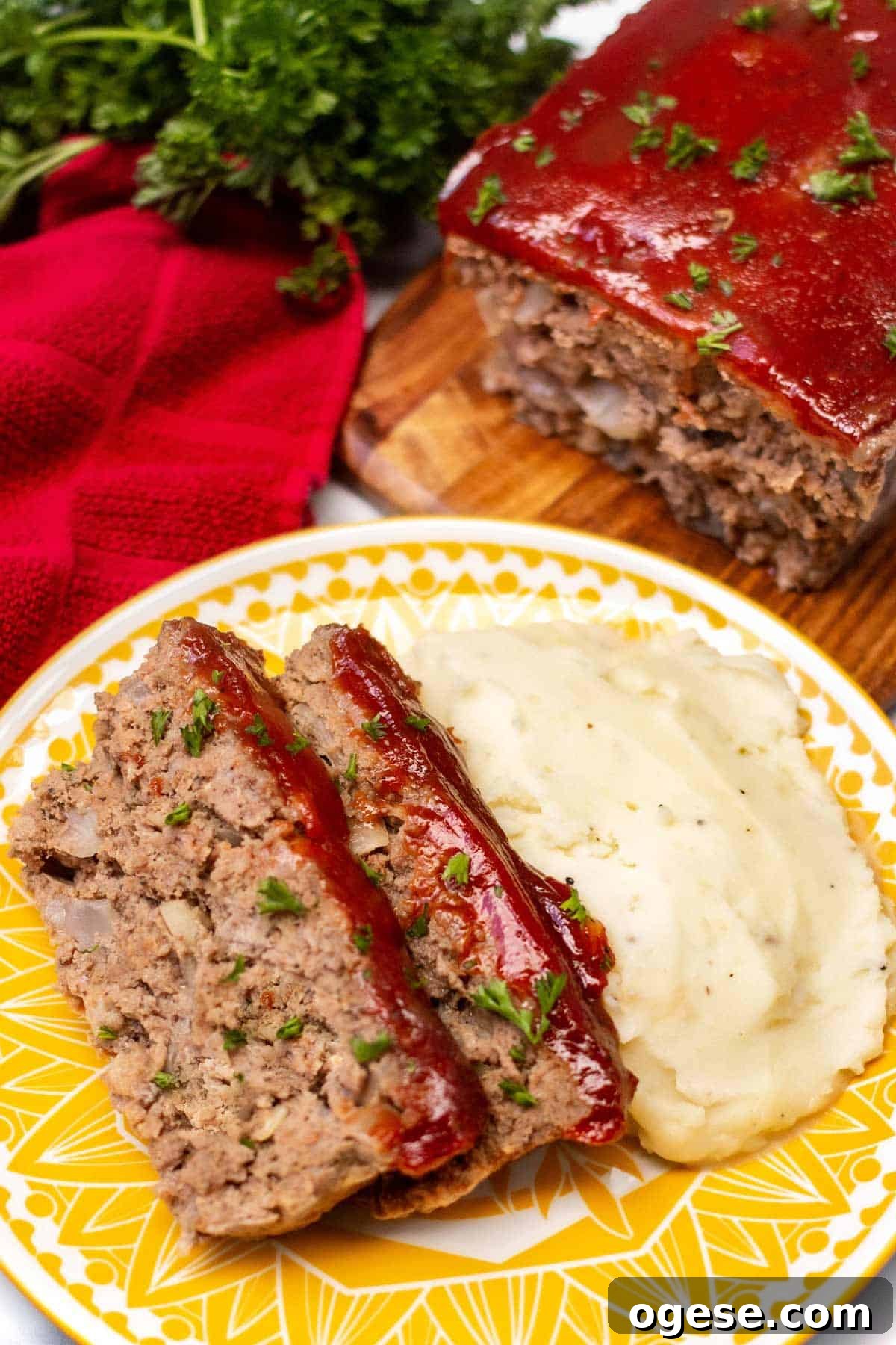 Classic Ritz-Crusted Meatloaf Recipe for Tender, Savory Results 9 Meatloaf with a ketchup glaze served with mashed potatoes
