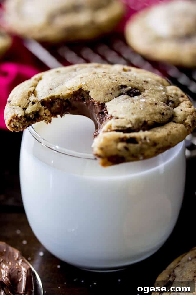 Nutella-Filled Chocolate Chip Cookies 4 Nutella Stuffed Cookies - made with brown butter and sprinkled with sea salt!