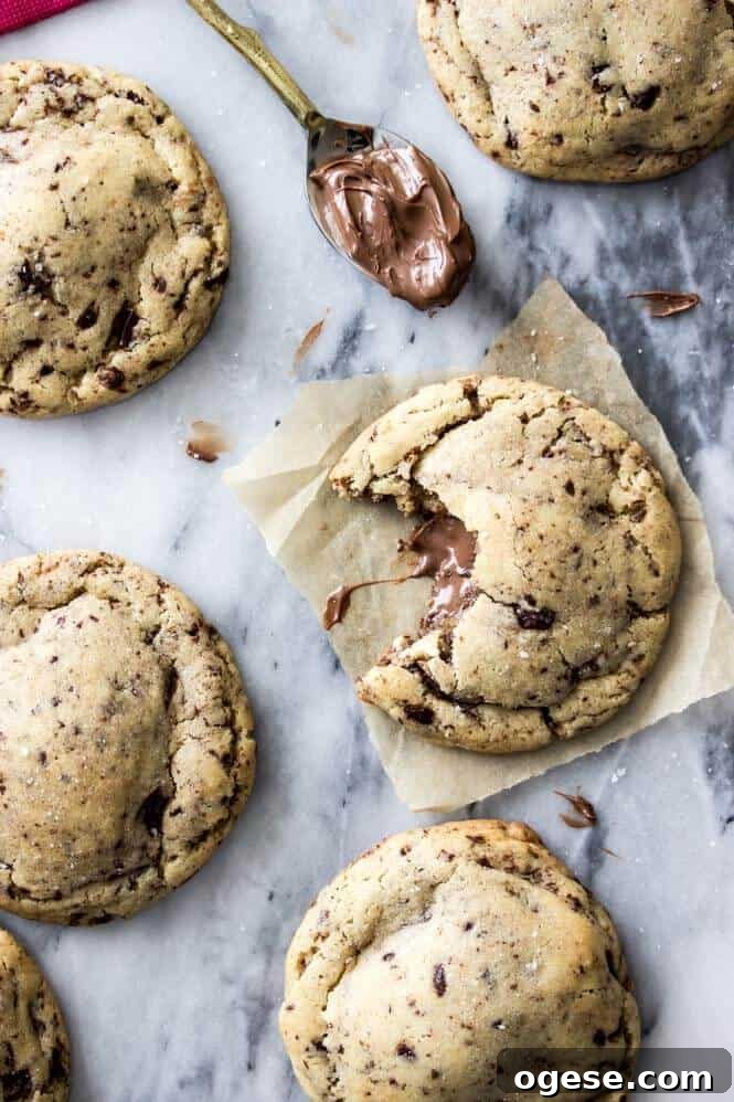 Nutella-Filled Chocolate Chip Cookies 6 Nutella Stuffed Cookies - made with brown butter and sprinkled with sea salt!
