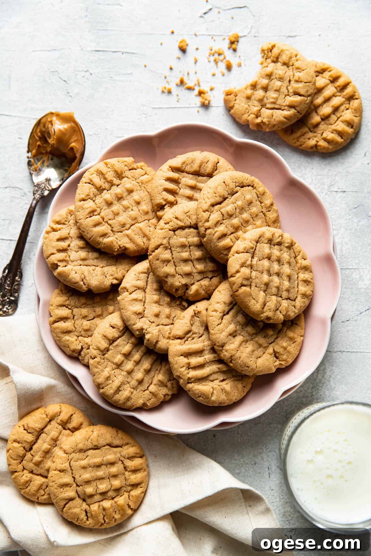 Chewy Peanut Butter Cookie Recipe for Perfect Cookies 2 peanut butter cookies on a plate.