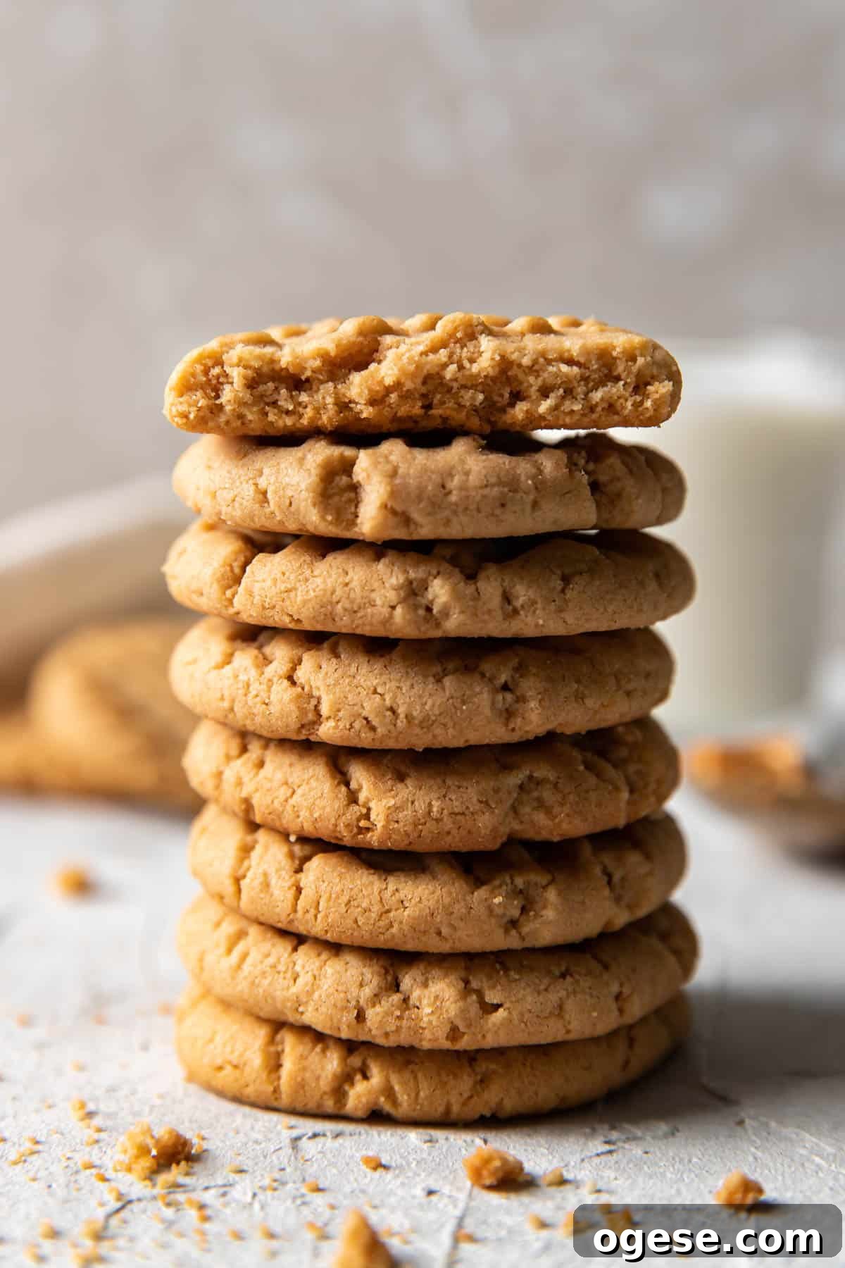 Chewy Peanut Butter Cookie Recipe for Perfect Cookies 7 peanut butter cookies stacked on top of each other.