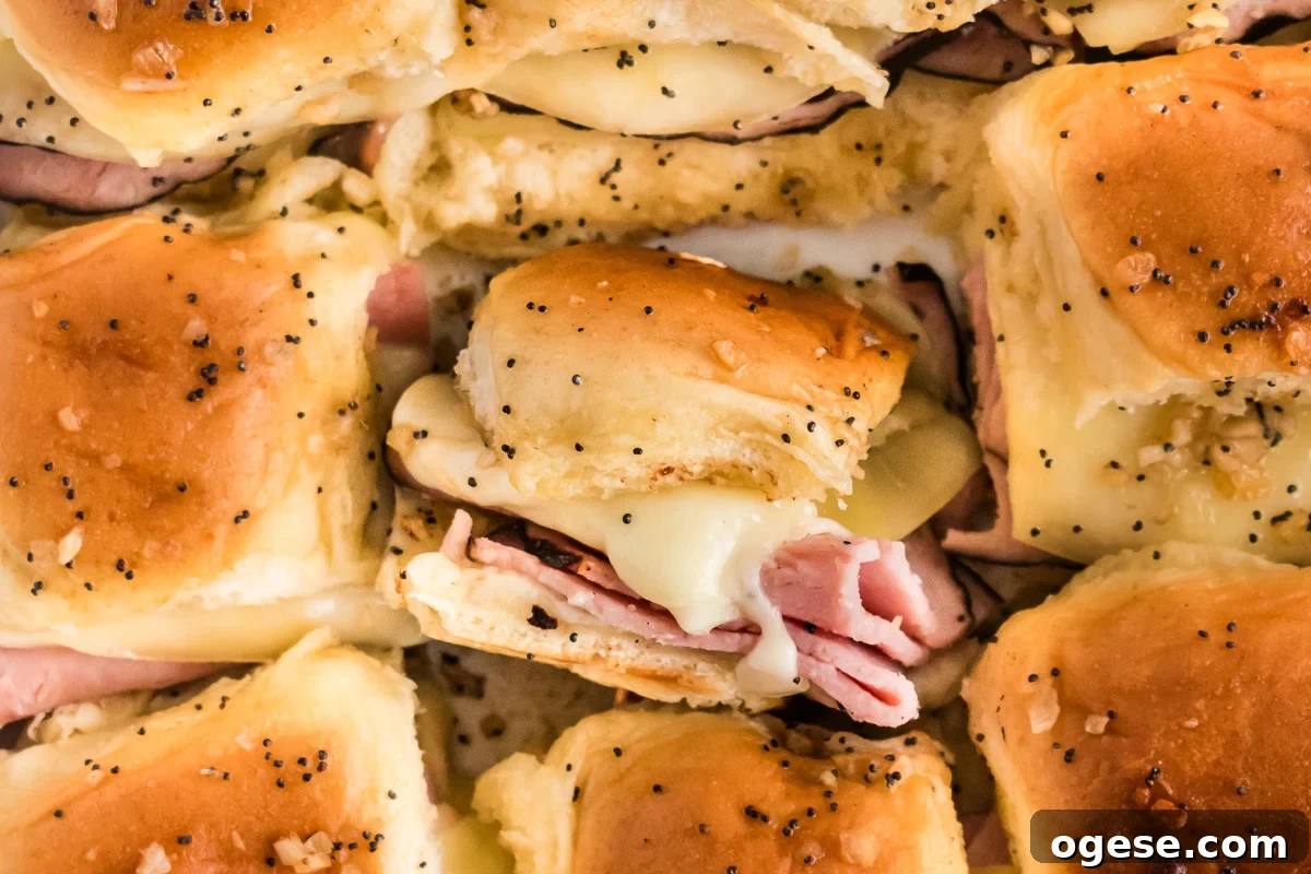 Ultimate Cheesy Ham and Melted Cheese Sliders Recipe 9 Overhead view of sliders in baking dish.