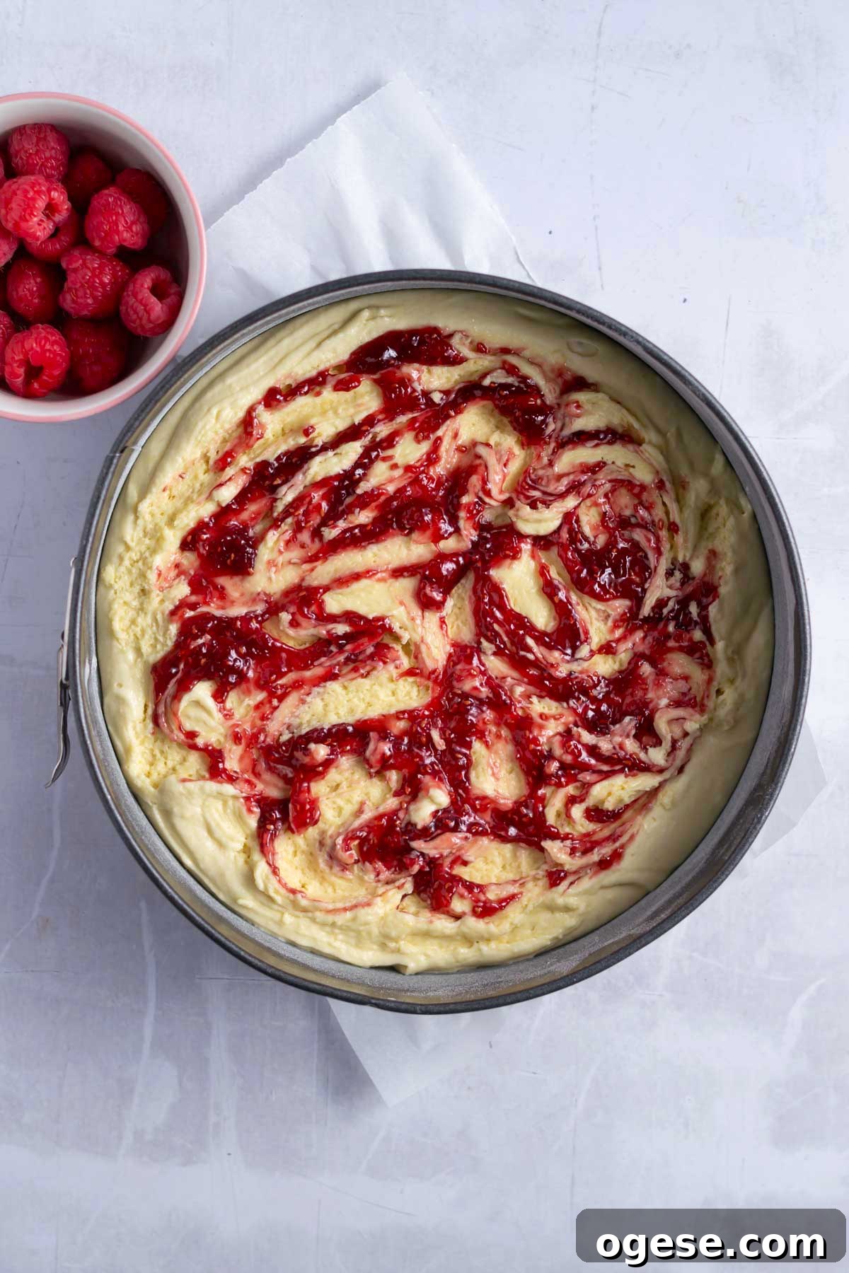 raspberry jam swirled into cake batter