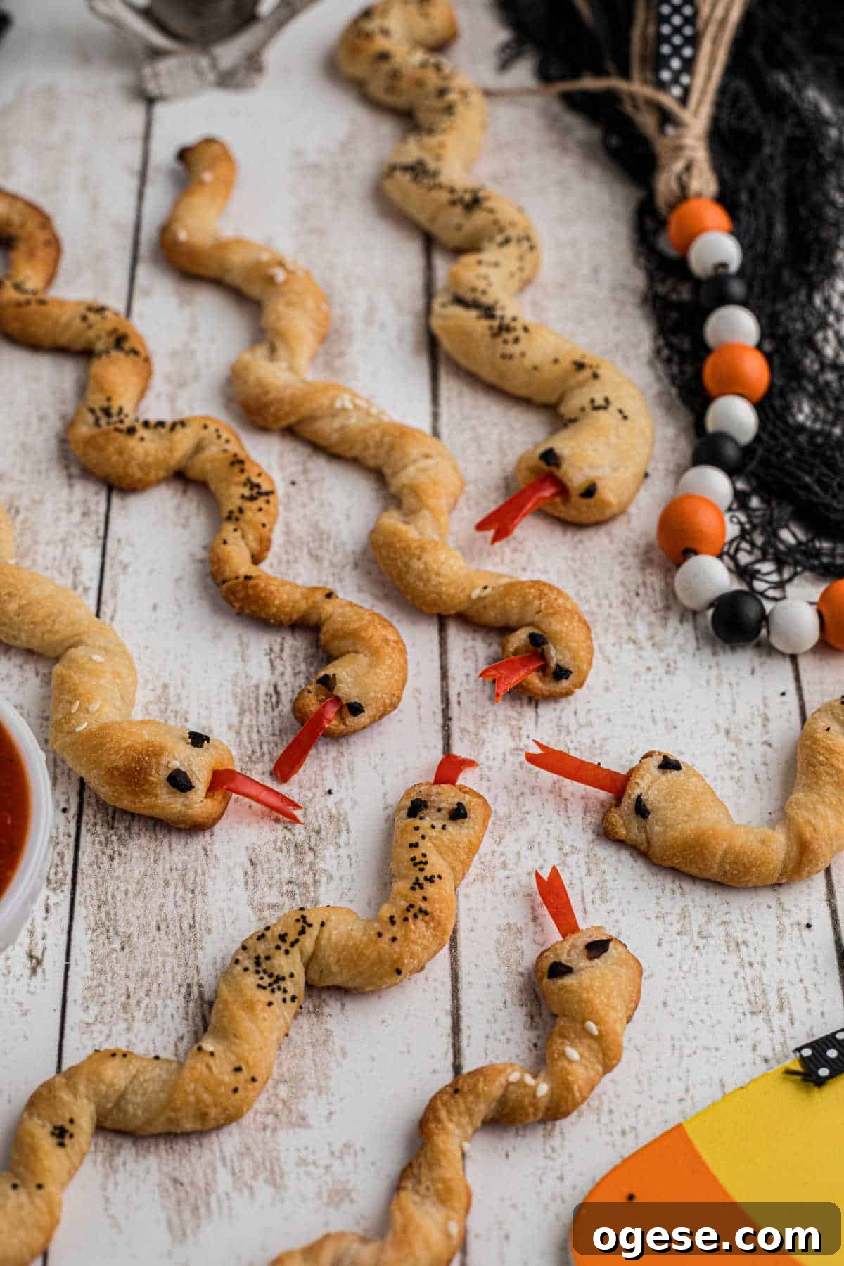 Crispy Breadstick Rattlers: Spicy Sausage-Stuffed Appetizers 15 Breadstick rattlers for Halloween.