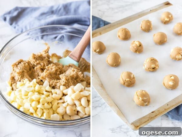 White Chocolate Macadamia Cookie dough - before the chocolate chips and nuts are stirred into the batter, and after the dough has been formed into balls and placed on a lined cookie sheet.