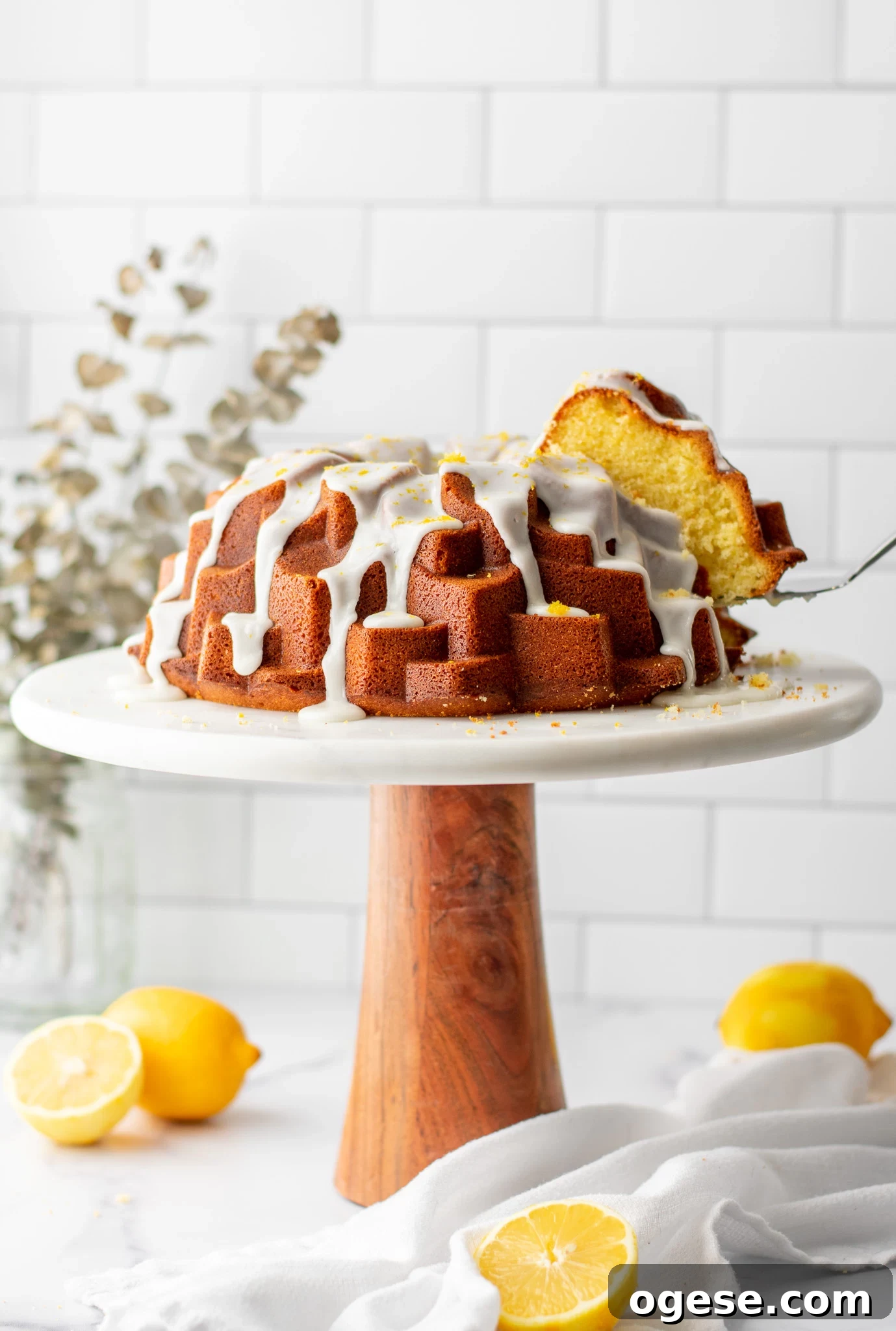 A slice of cake cut out of a lemon bundt cake.