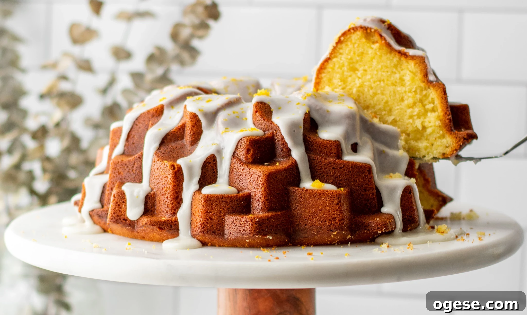 A piece of cake cut from a lemon bundt cake.
