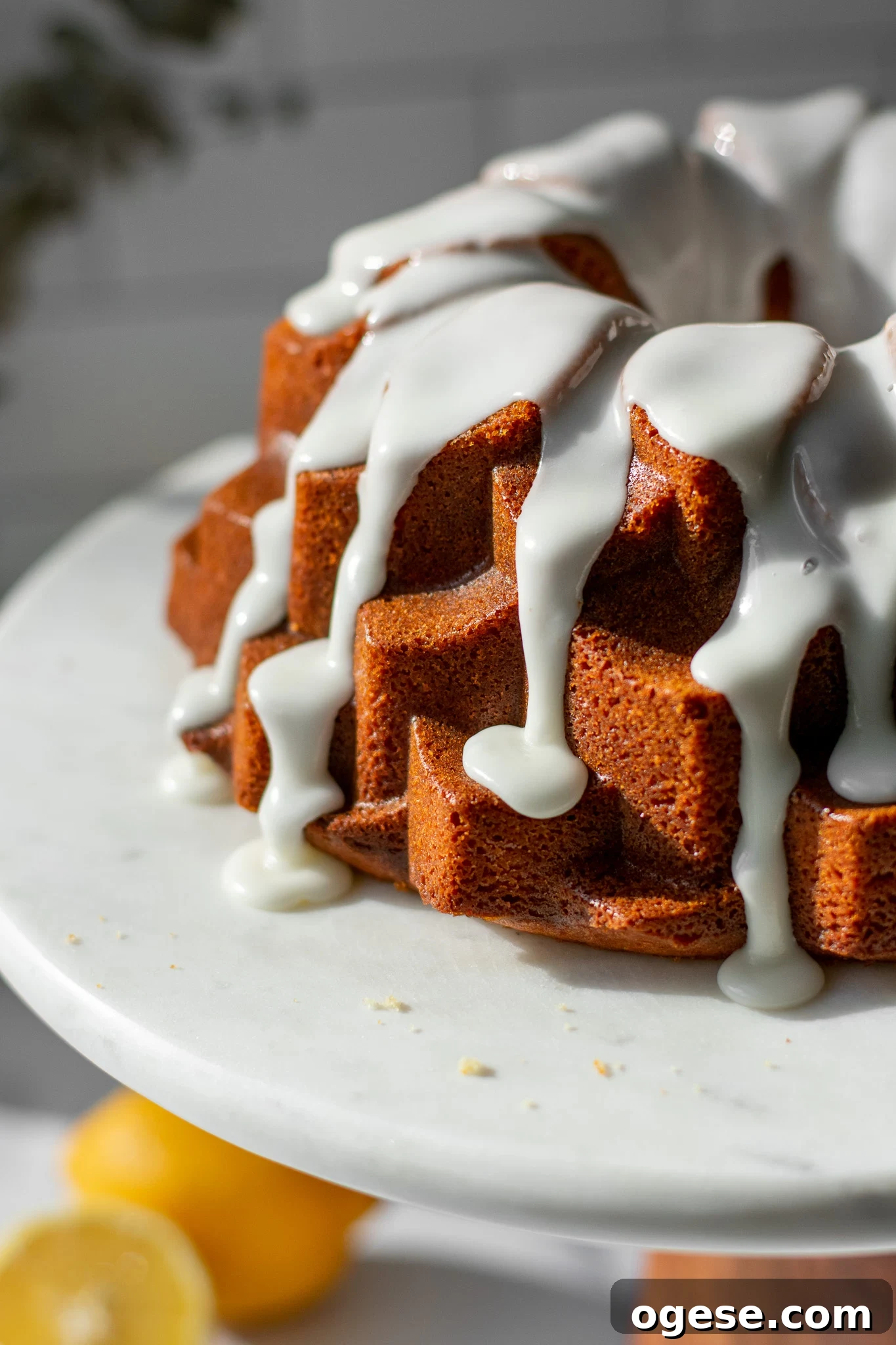 Icing dripping from a lemon bundt cake.