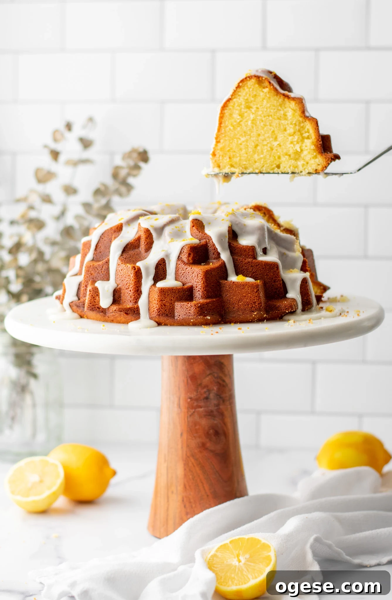 A piece of cake cut from a lemon bundt cake.