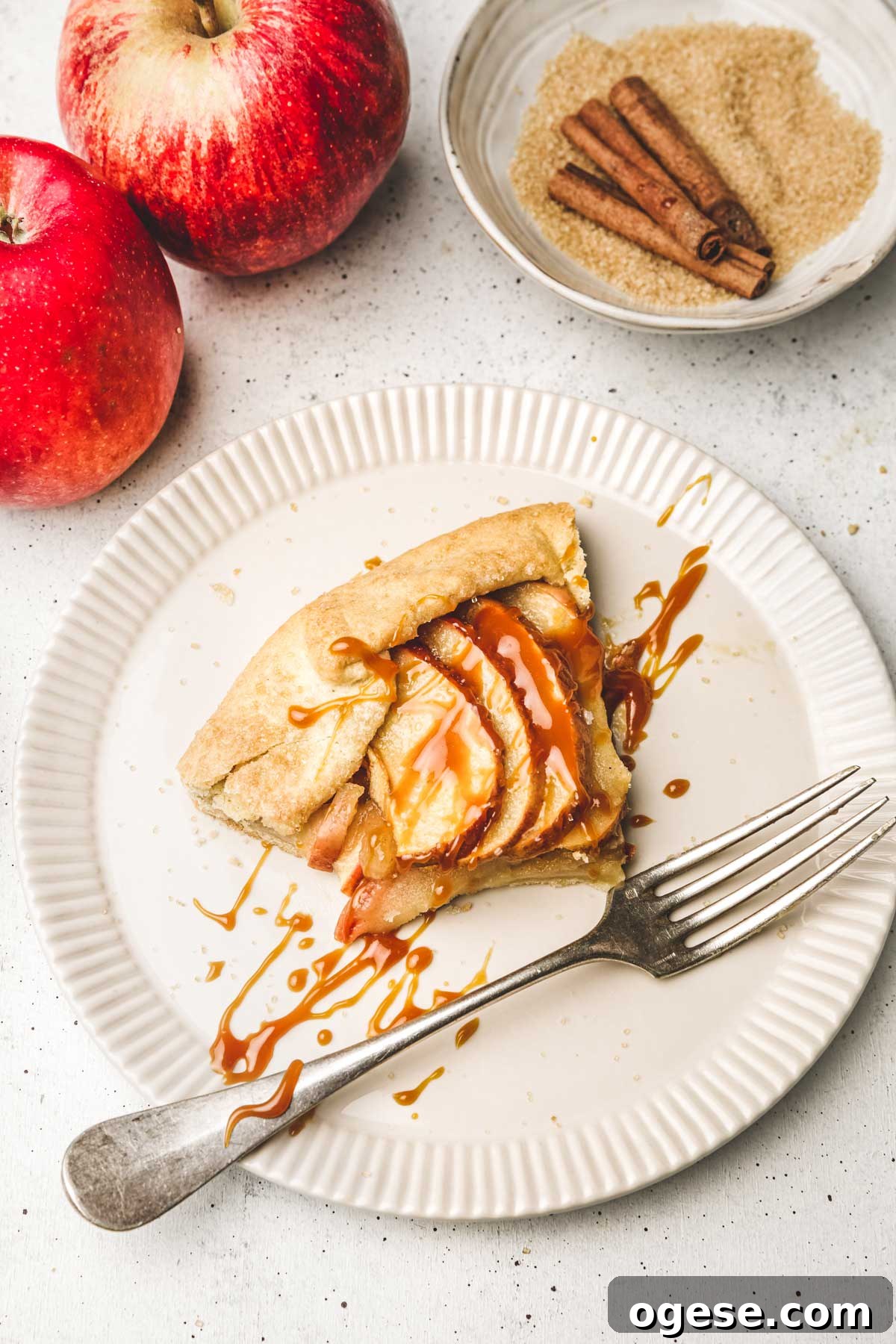 Rustic French Apple Tart Recipe: Classic Free-Form Tarte Tatin Alternative 14 Slice of rustic apple tart with fork and ice cream