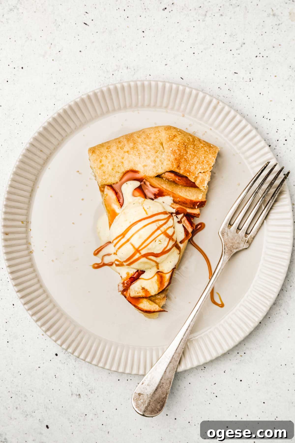 Rustic French Apple Tart Recipe: Classic Free-Form Tarte Tatin Alternative 9 Slice of rustic apple tart with fork and ice cream