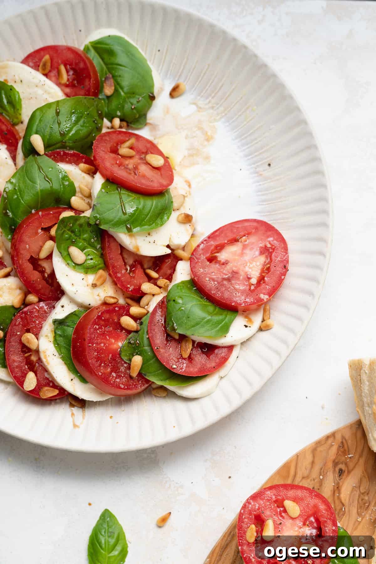 Classic Caprese Salad Recipe: Fresh Mozzarella, Tomatoes & Basil 11 Caprese salad on a plate.