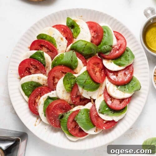 Classic Caprese Salad Recipe: Fresh Mozzarella, Tomatoes & Basil 12 Caprese salad on a plate.