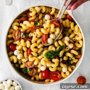 Classic Caprese Salad Recipe: Fresh Mozzarella, Tomatoes & Basil 4 Caprese Pasta Salad in a bowl.