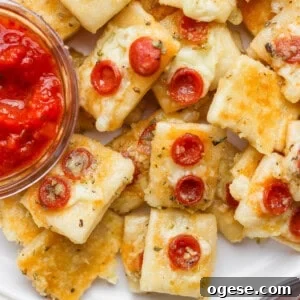 Classic Caprese Salad Recipe: Fresh Mozzarella, Tomatoes & Basil 9 Close-up of mini cheese and pepperoni pizza bites.