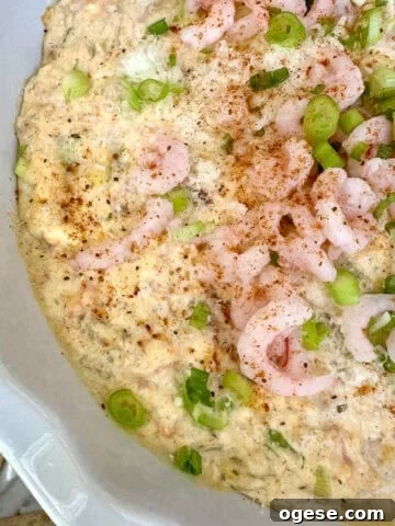 A baking dish with creamy shrimp and crab dip.
