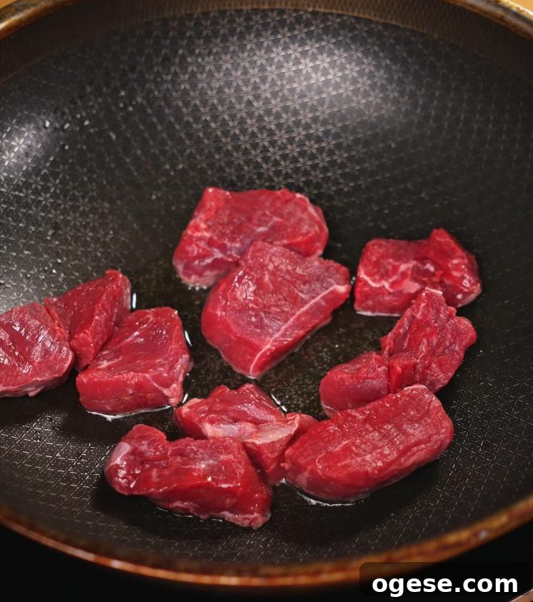 Authentic Japanese Beef Curry Recipe: Rich, Slow-Simmered Stew 4 Raw beef cubes are seared in a large skillet to develop a rich brown crust, an essential step for building flavor in Japanese curry.