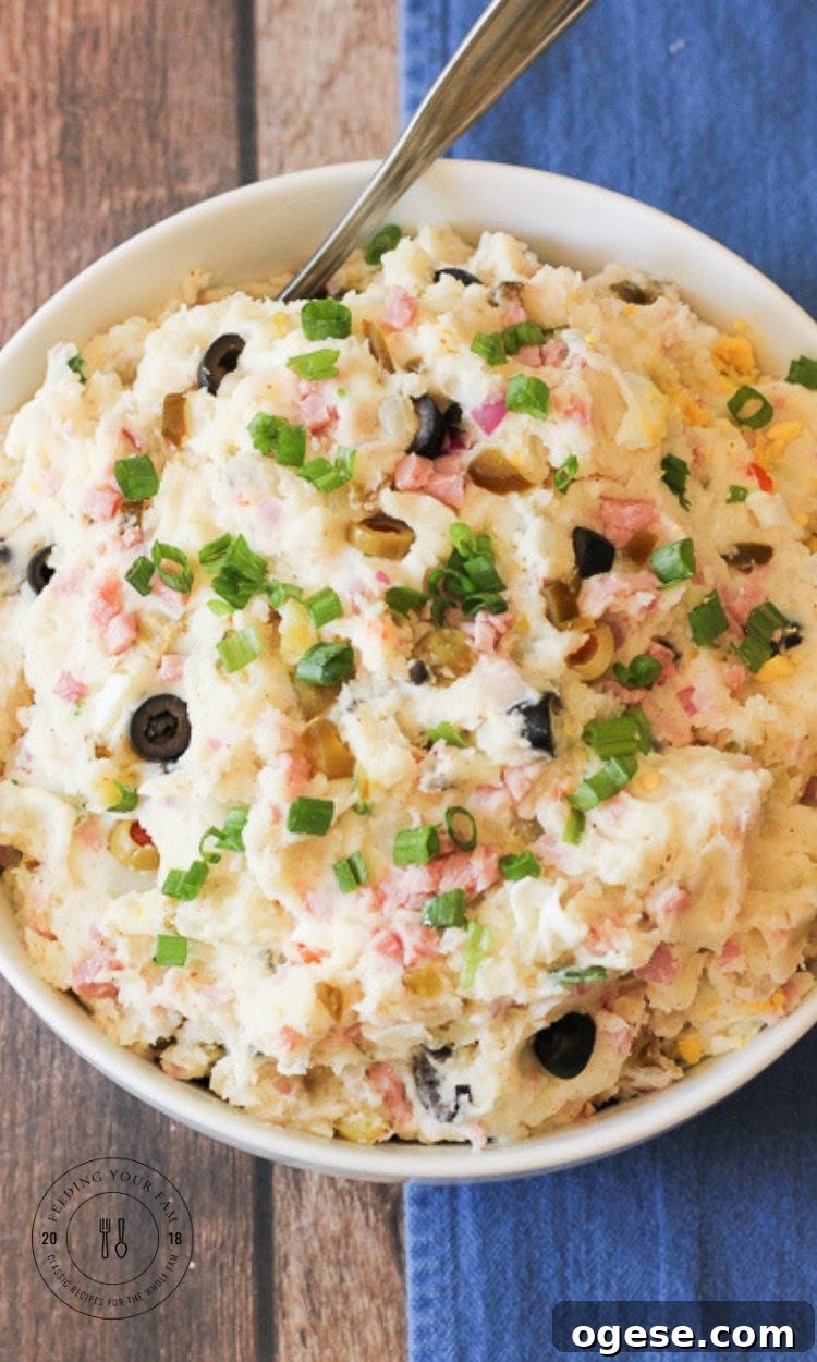 warm potato salad in a white bowl