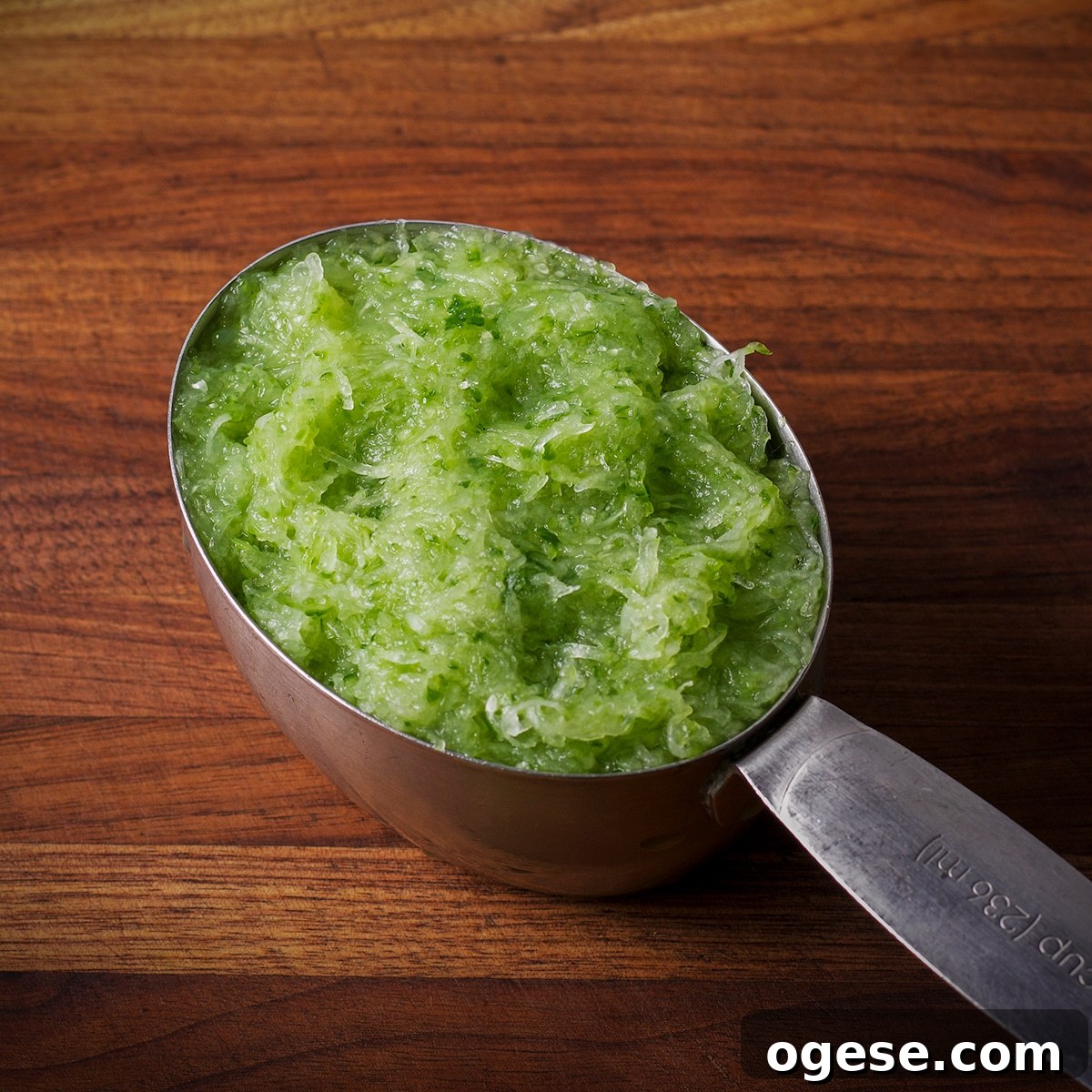 Traditional and Vegan Tzatziki: Two Authentic Recipes You’ll Love 5 A one-cup measure containing grated cucumber.