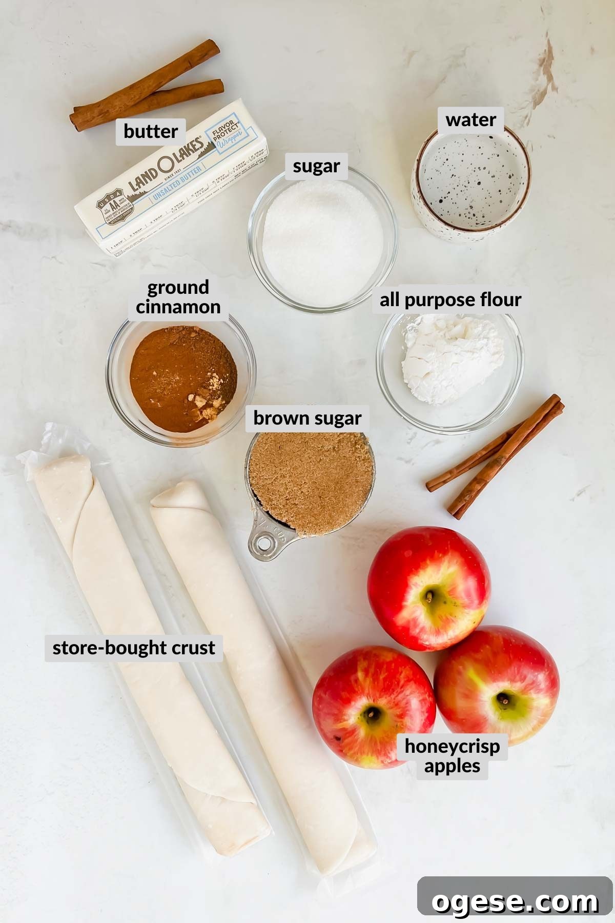 ingredients needed for easy apple pie with store bought crust on white background.