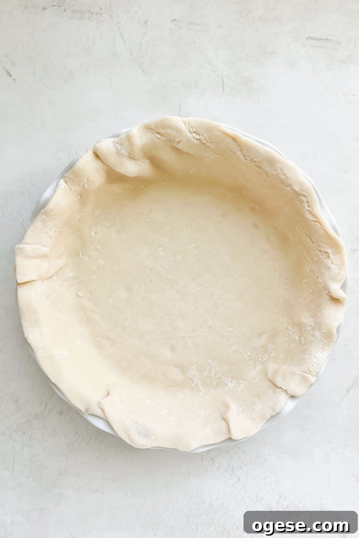 store bought pie crust firmly pressed into a glass pie dish.