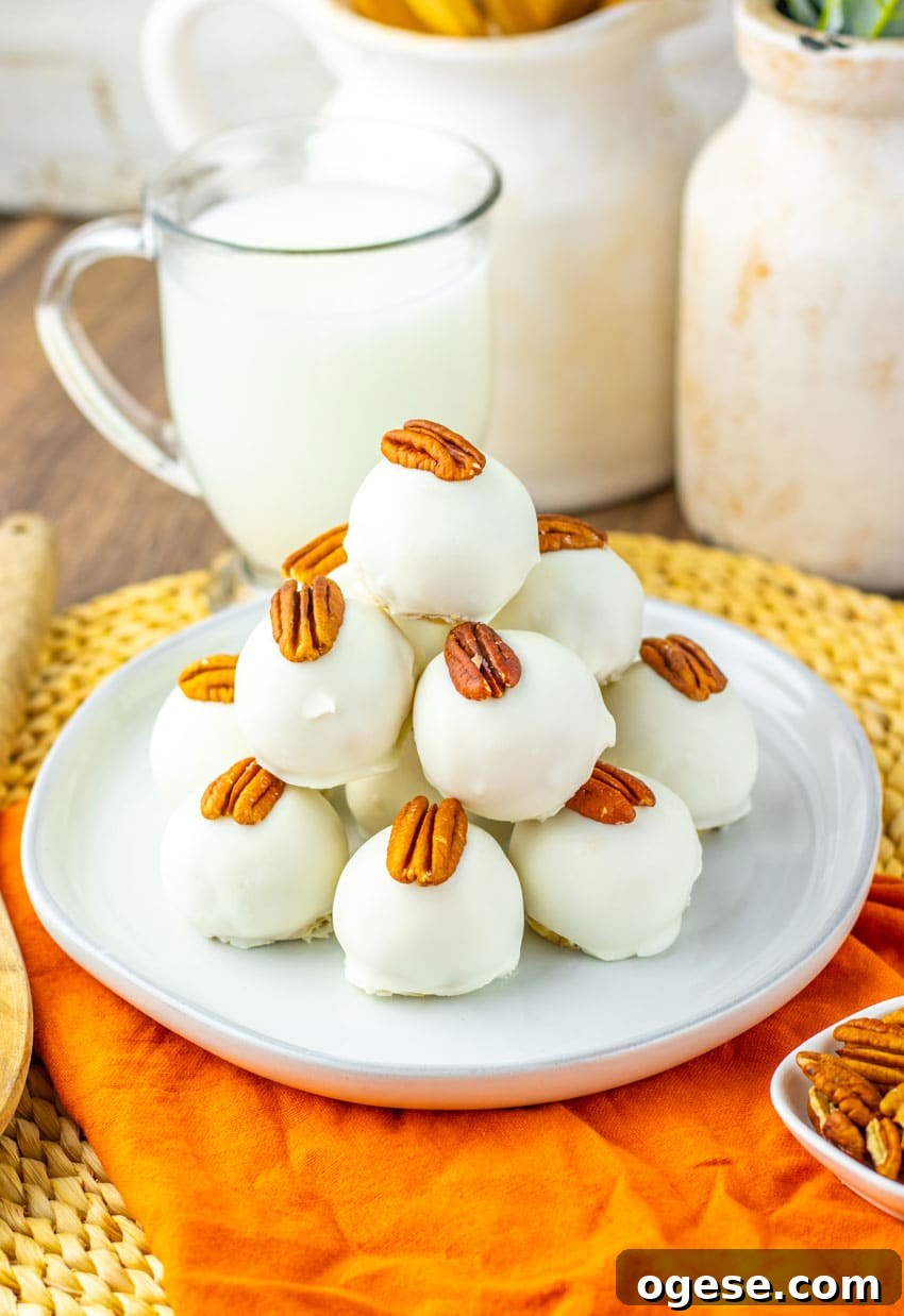 Pecan Pie Truffles Recipe — Bite-Sized Holiday Dessert 47 a stack of pecan pie truffles on a white plate