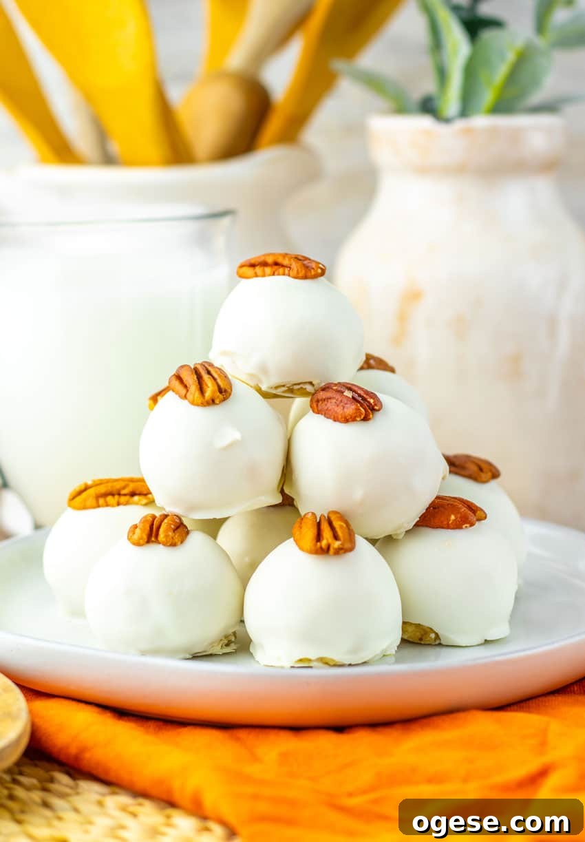 a stack of pecan pie truffles on a white plate