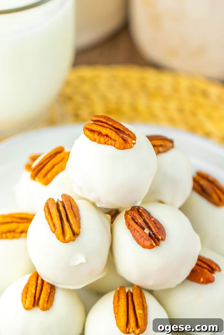 a stack of pecan pie truffles on a white plate