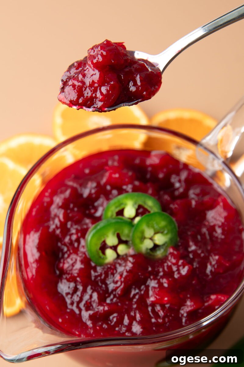 Spicy Jalapeño Cranberry Sauce Recipe for Holiday Meals 4 spoonful of Jalapeno Cranberry Sauce