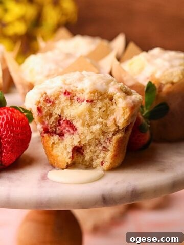 Strawberry short cake muffins on a cake platter.