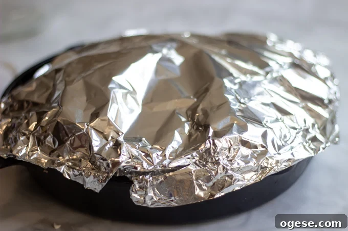 Homestyle Ground Beef and Egg Noodle Casserole (Video) 11 tented foil over the skillet
