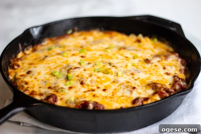 Homestyle Ground Beef and Egg Noodle Casserole (Video) 12 The finished cheesy hamburger casserole topped with sliced green onions