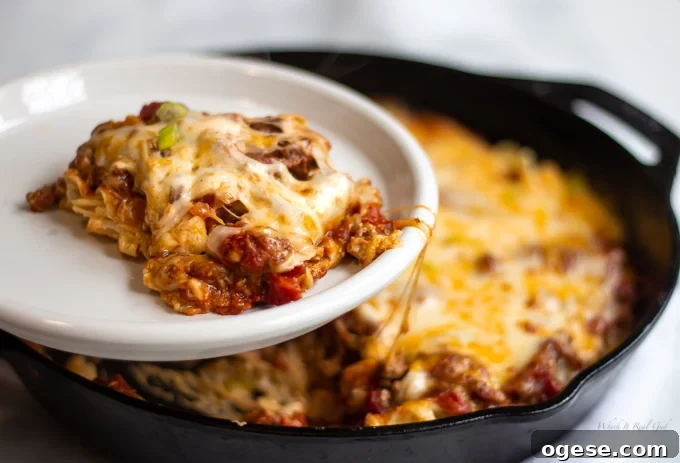 Homestyle Ground Beef and Egg Noodle Casserole (Video) 13 A plate of sliced homestyle ground beef casserole