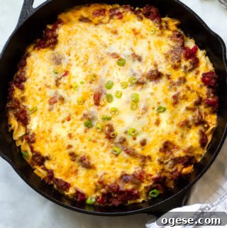 Ground beef egg noodle casserole topped with melted cheeses