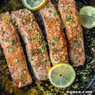 Cooked salmon in pan.