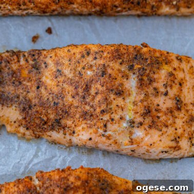 Square image of baked salmon.