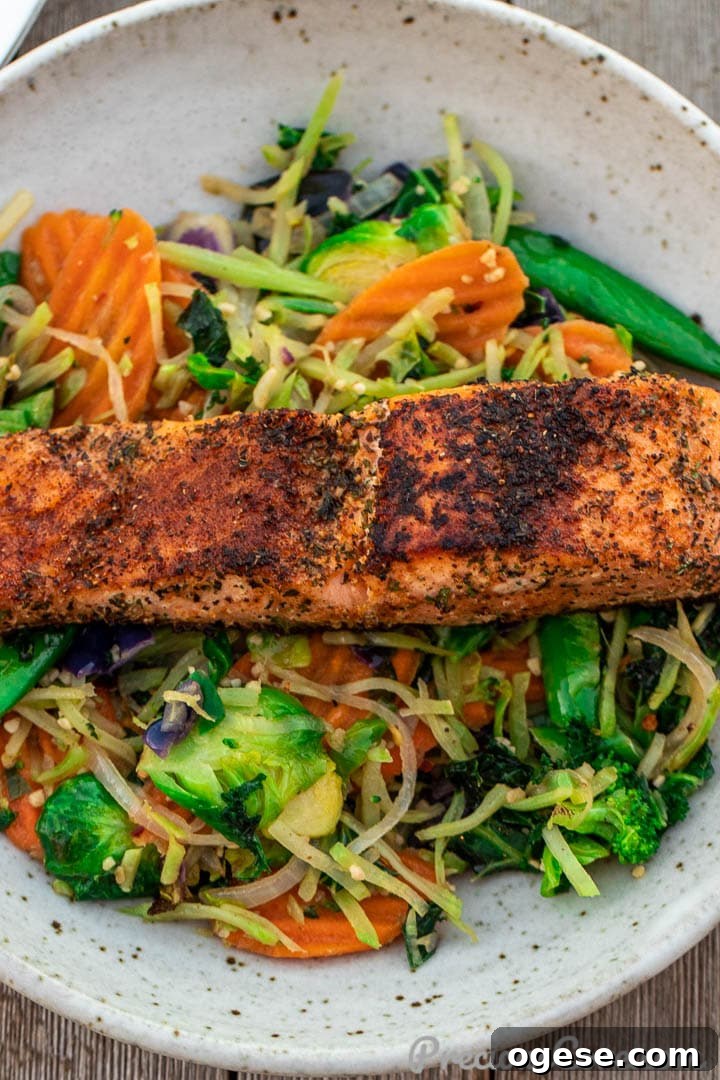A plate with vegetables and salmon