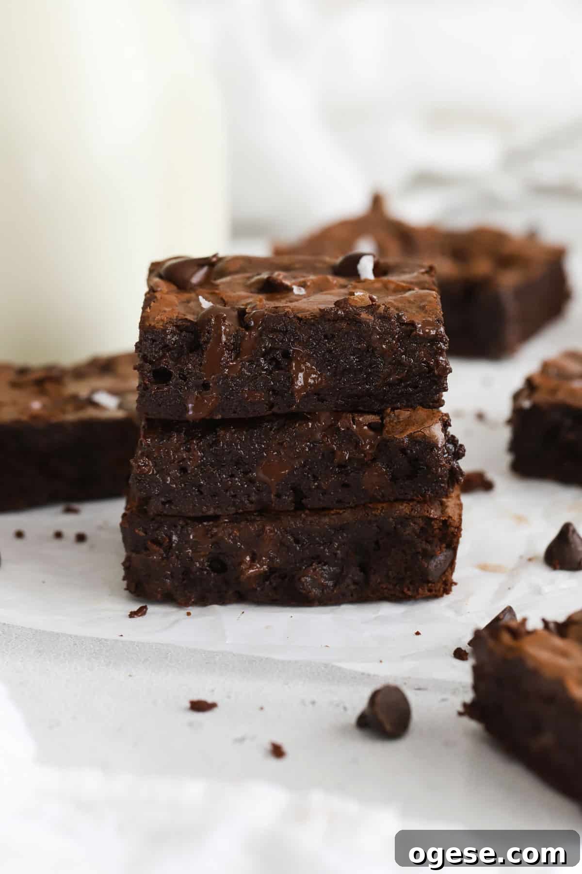 A small batch of gluten-free brownie squares and a bottle of milk