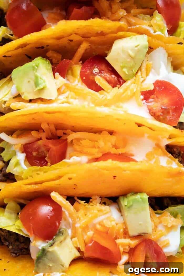 Low-Carb Taco Casserole with Cheesy Cauliflower Crust 7 overhead closeup view of keto cheese taco shells filled with taco ingredients