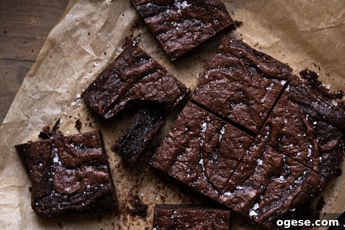 Almond Flour Brownies with Crackly Top — Fudgy Gluten-Free Treat 4 Freshly backed almond flour brownies garnished with flakey sea salt