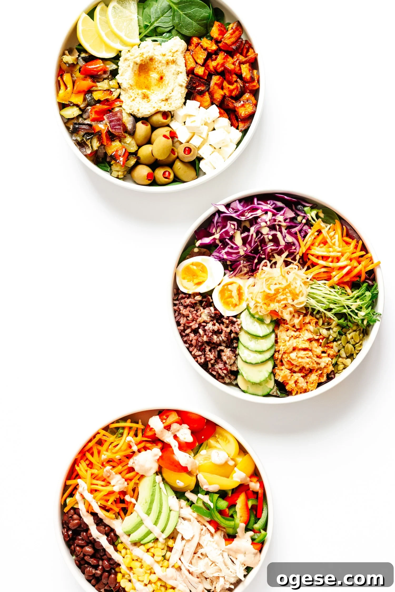 Create Your Own Nourish Bowl: Customizable Healthy Grain Bowl Recipe 2 Three different healthy nourish bowls arranged in a curve on a white background.