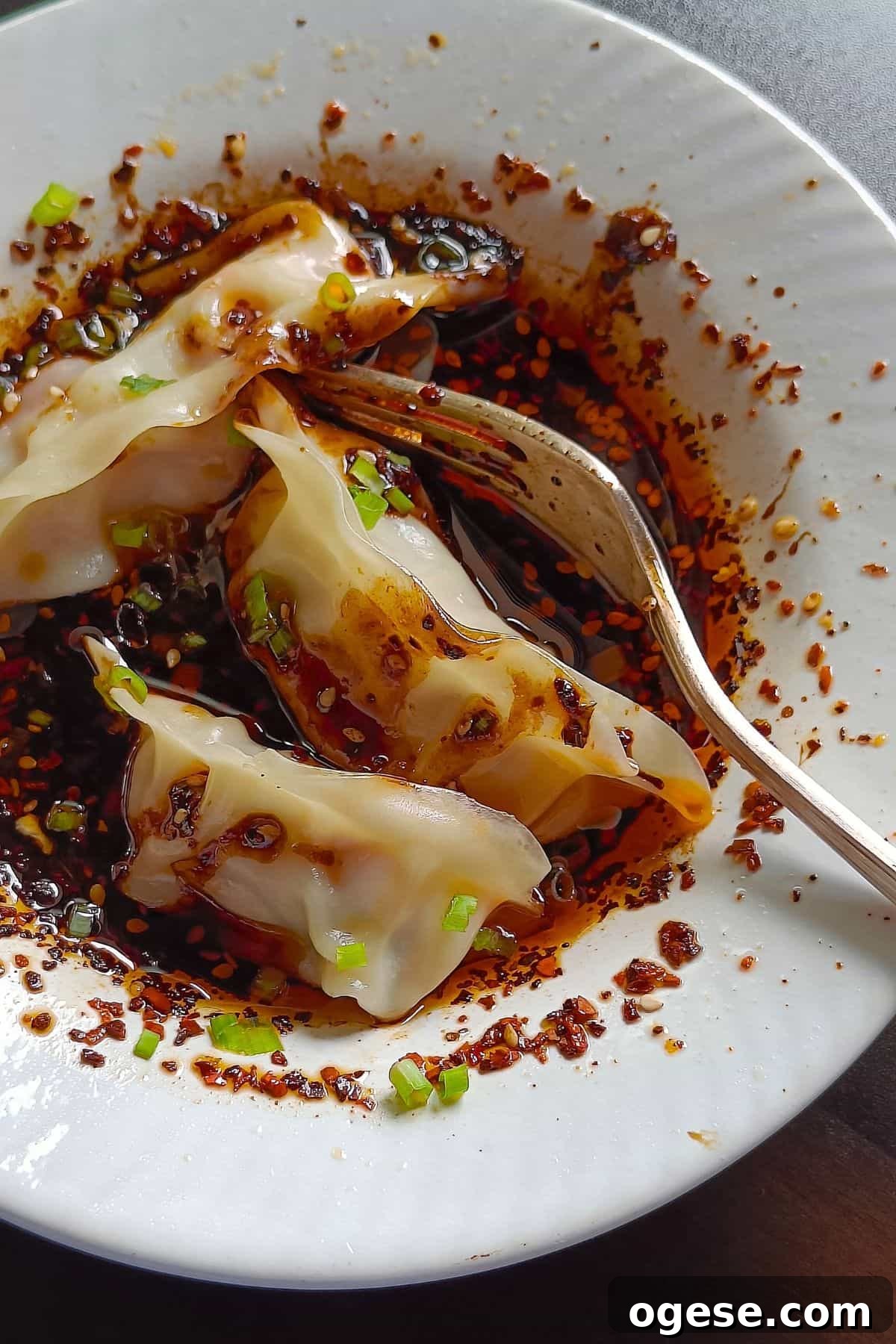 Image showing wet wet sauce in a bowl with steamed dumplings.