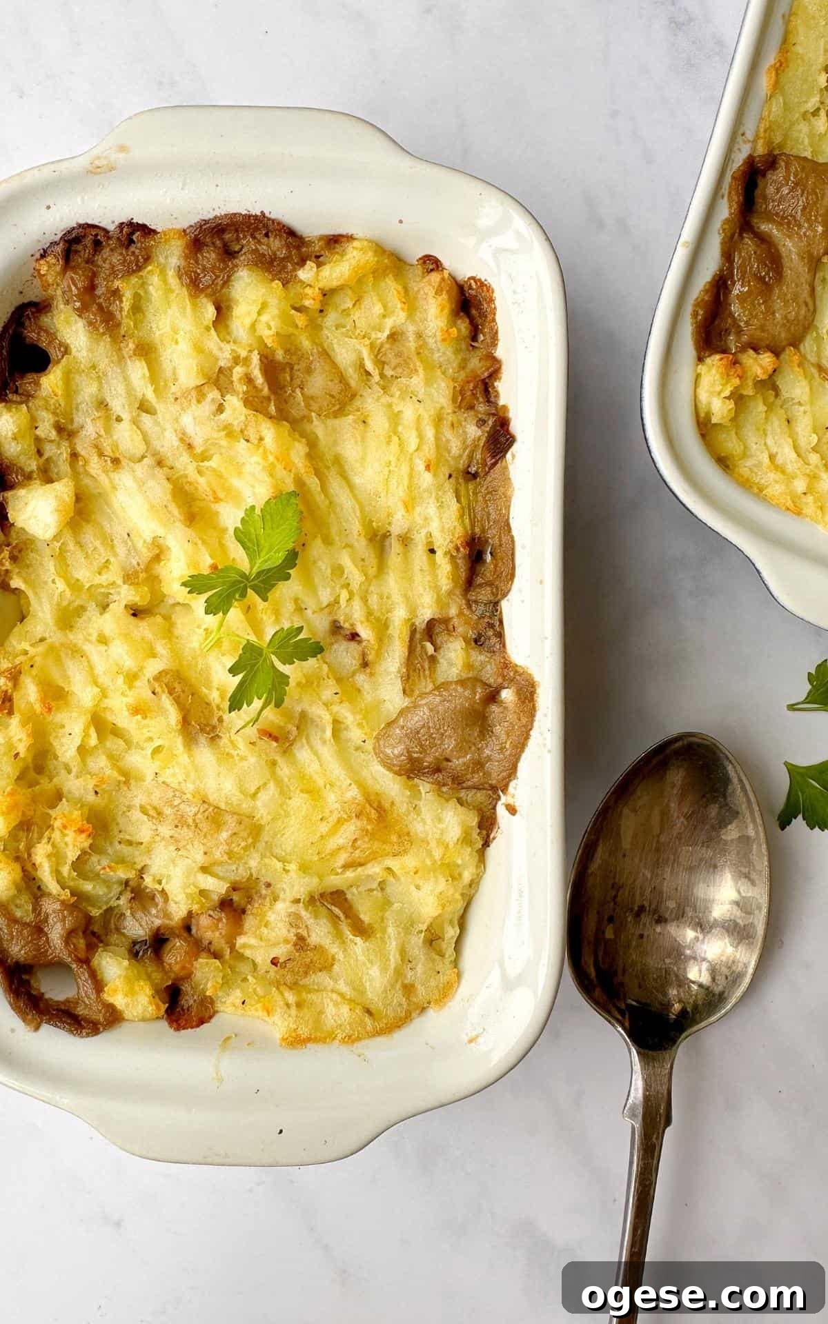 Vegan Mushroom Pie in a baking dish with a silver serving spoon.