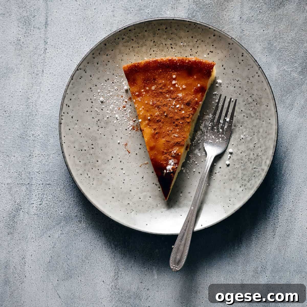 a slice of pie served on a grey plate