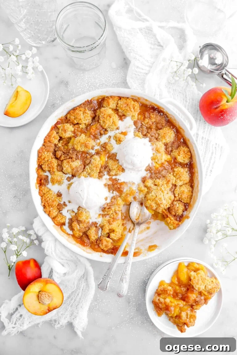 overhead shot of peach cobbler with ice cream