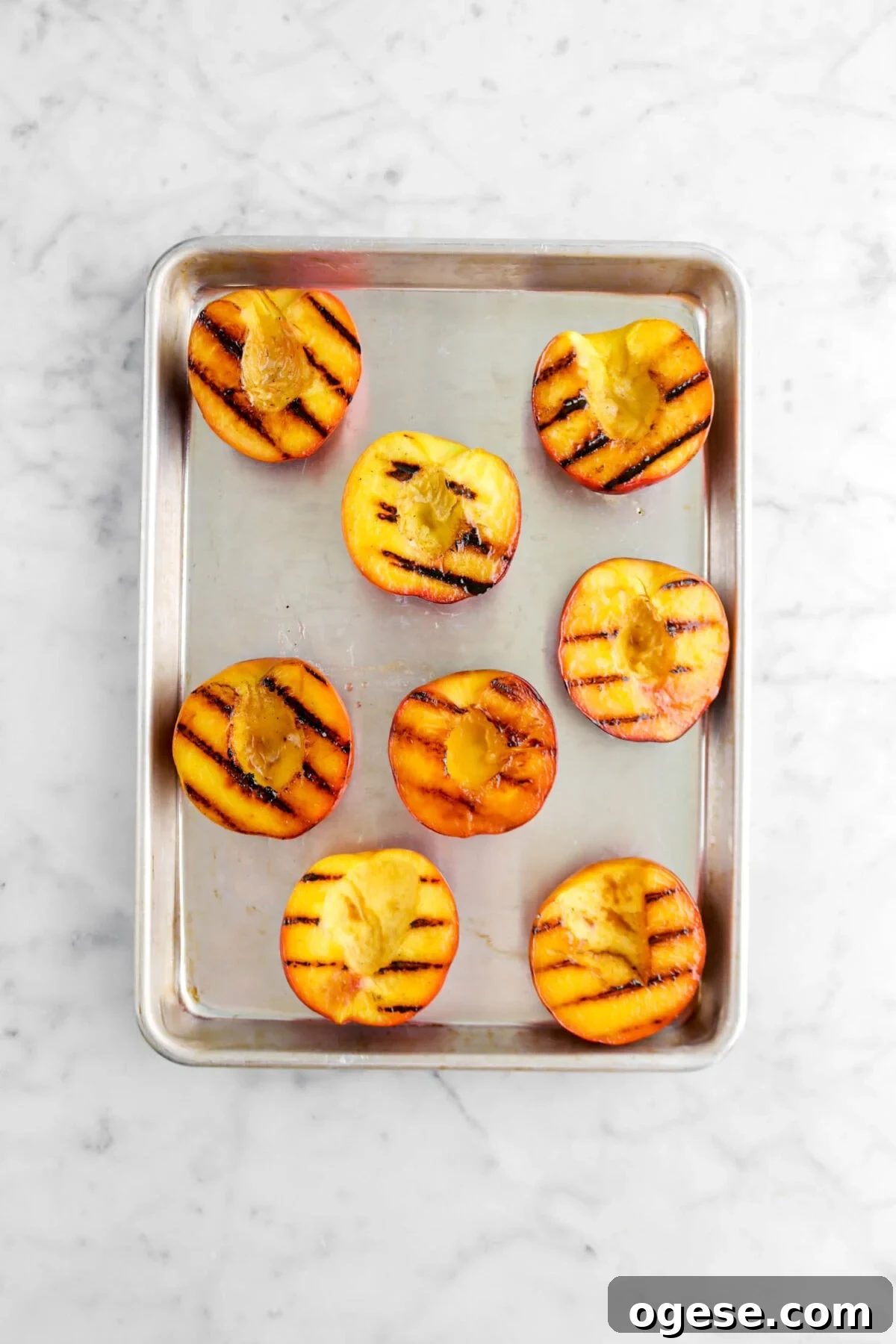grilled peaches on small sheet pan