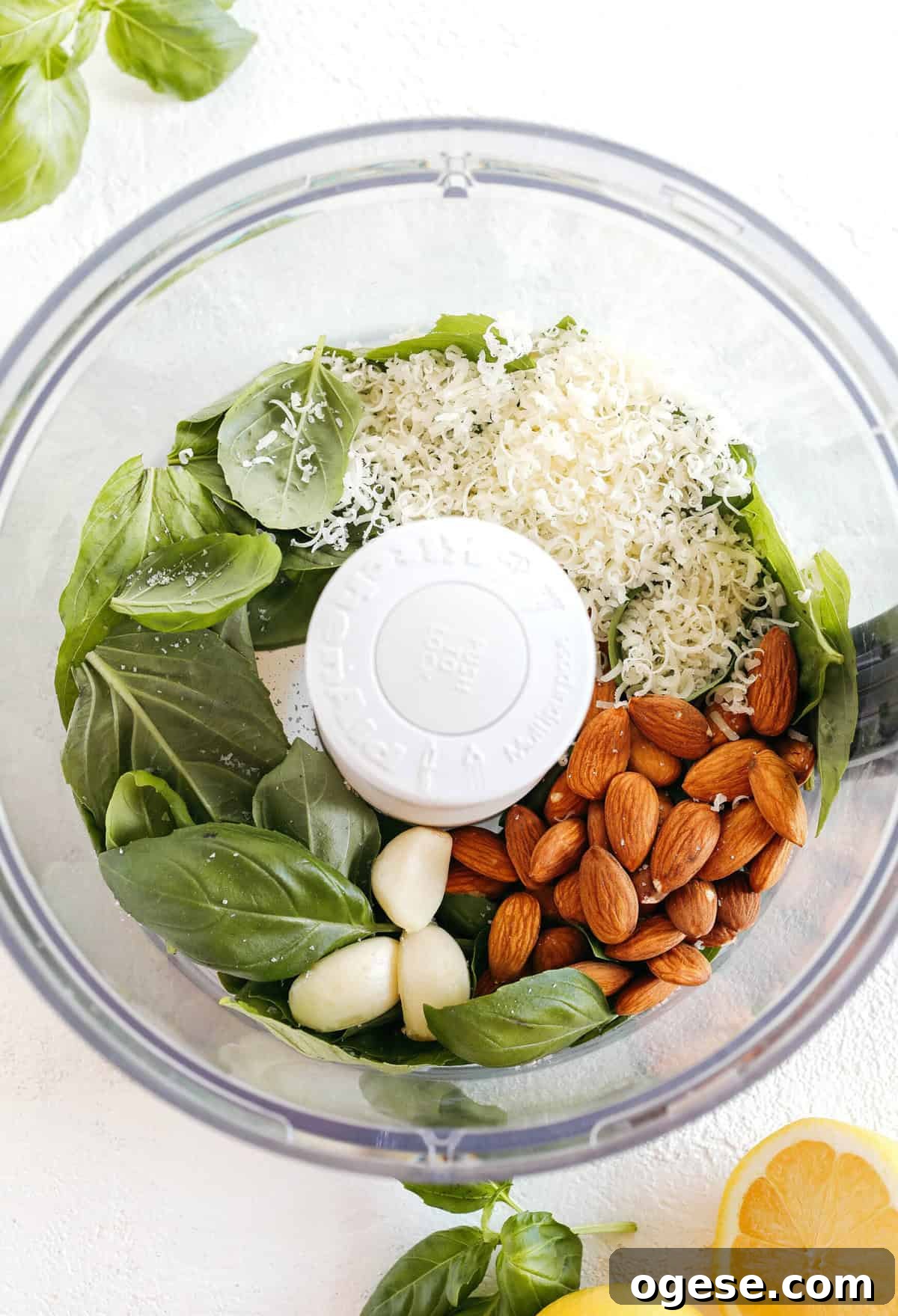 This Simple Basil Almond Pesto recipe combines fresh, delicious ingredients that is easily made in just 10 minutes! So versatile and perfect with pizza, pasta, chicken, shrimp or veggies!