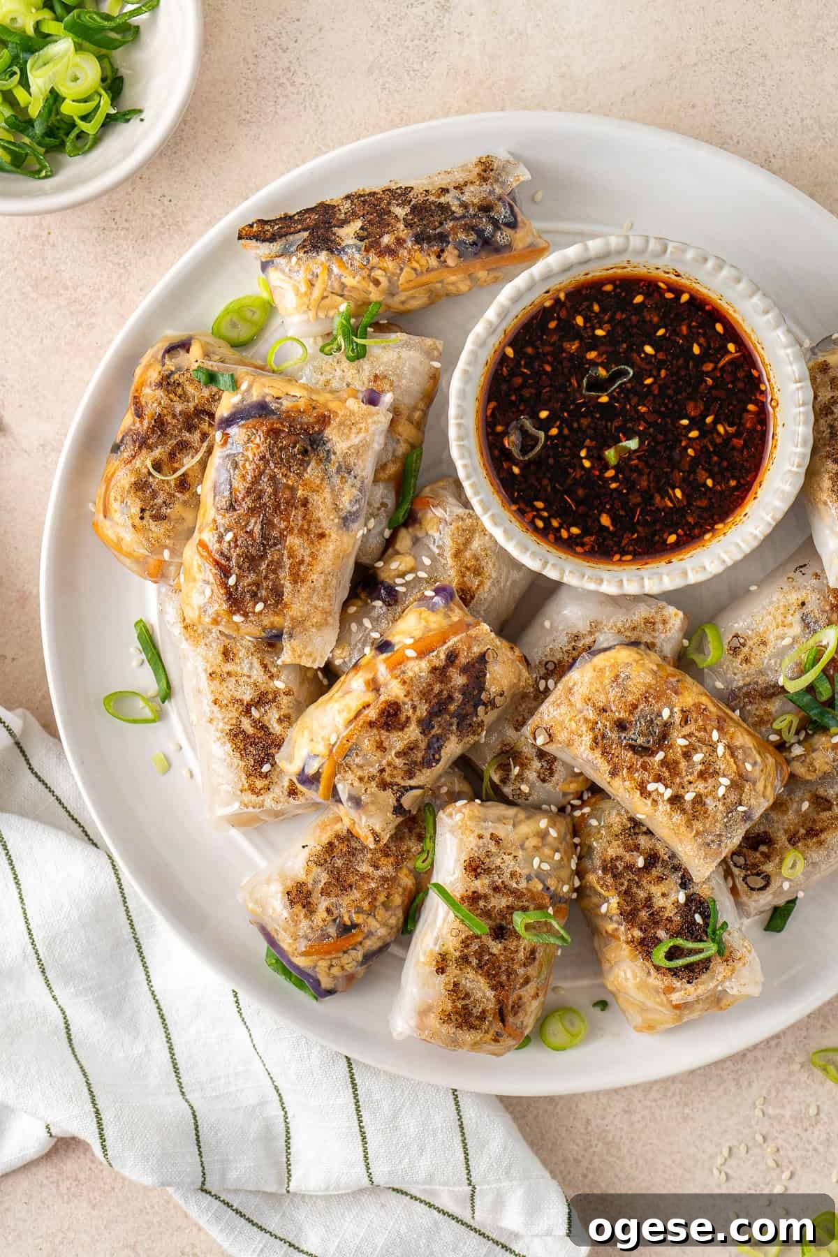 Crispy Rice Paper Dumplings Recipe — Crunchy Asian-Style Bites 10 The crispy rice paper dumplings on a plate with dipping sauce.